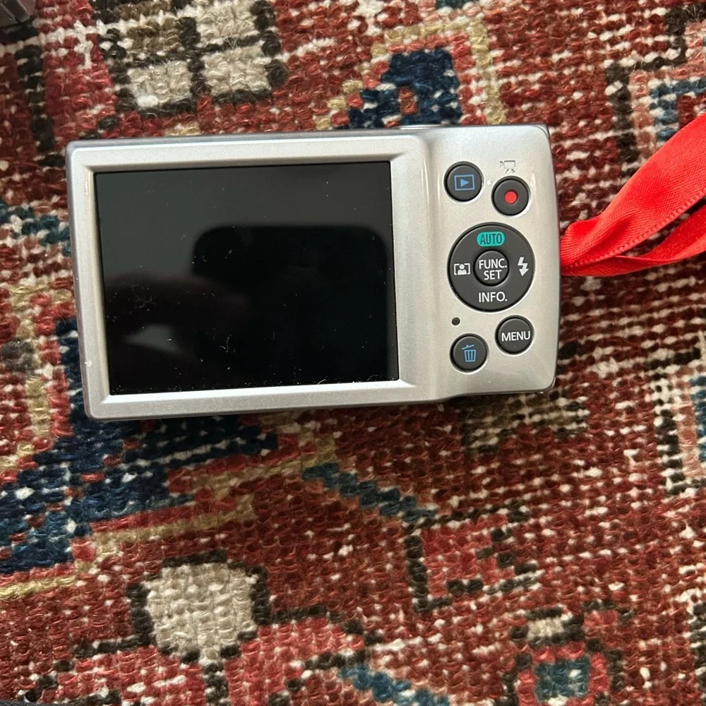 Canon Silver Digital Camera with Red Accents